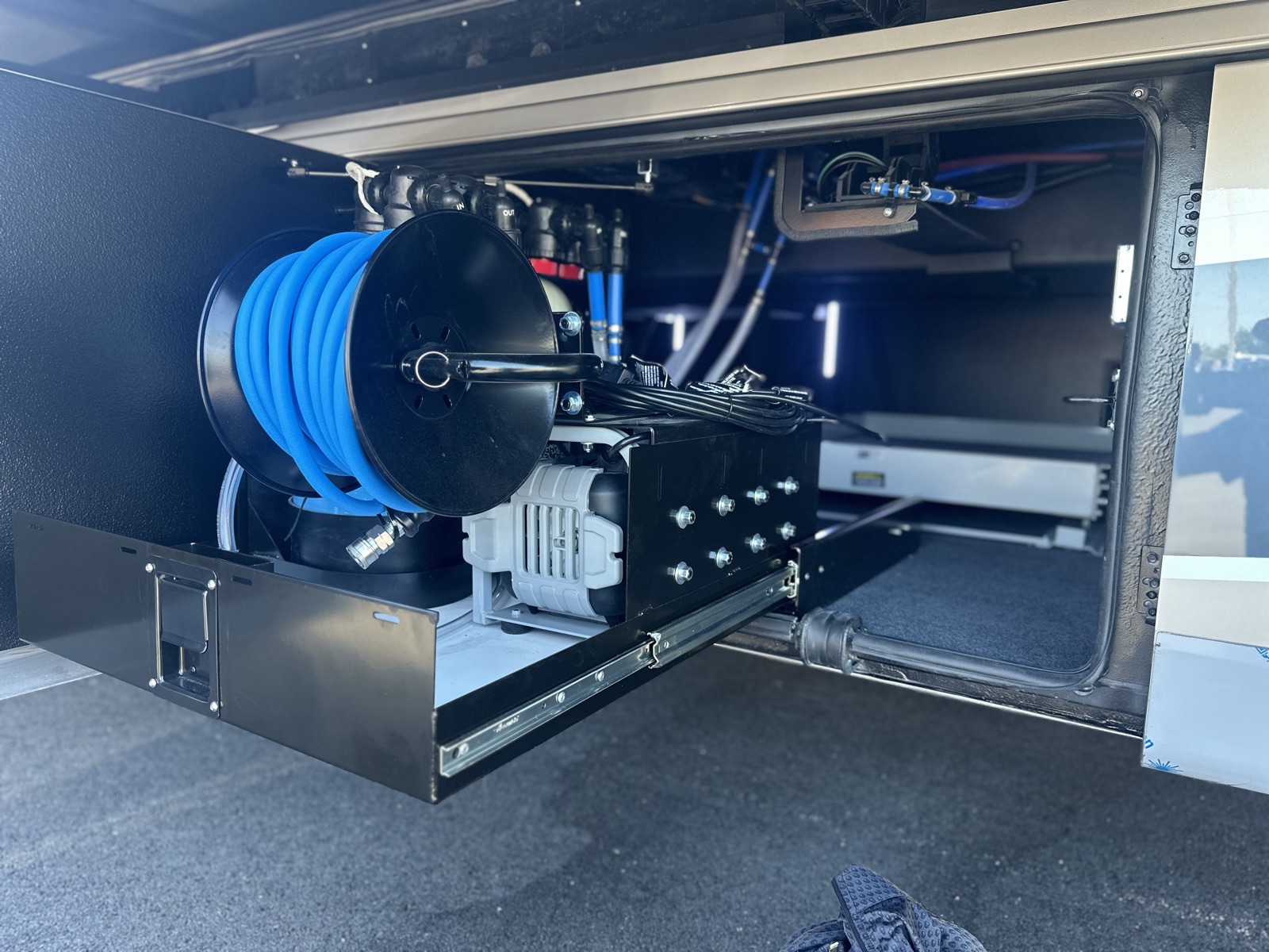Close-up of the H2O Simplified pump, advanced filtration and spot-free rinse hose reel