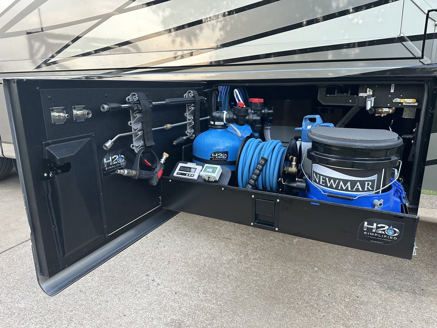 The patented H2O Simplified 3-in-1 water treatment system installed in a service bay