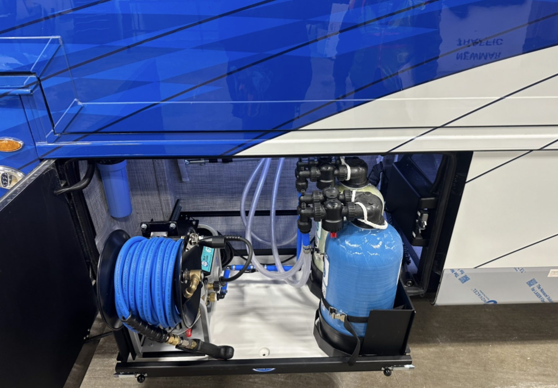 The patented H2O Simplified water treatment system, pump, advanced filtration tank and spot-free rinse reel, installed in a luxury coach service bay